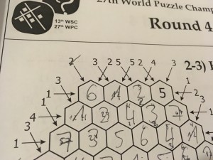 A hexagonal skyscrapers puzzle with a lot of clues.